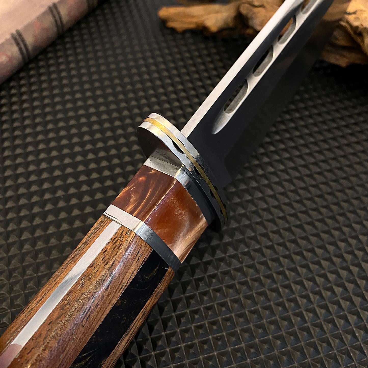 Outdoor tactical straight knife with wooden handle, featuring a nylon sheath—ideal for wilderness expeditions.